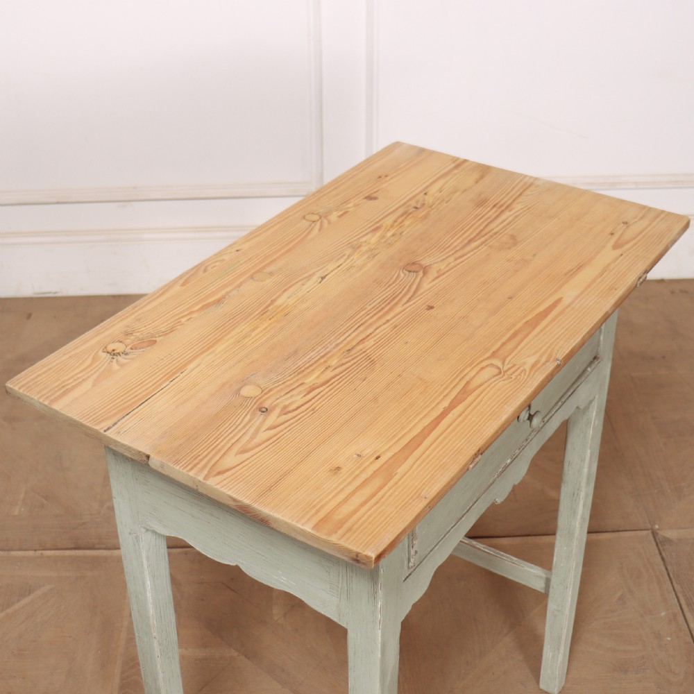 A pair of 19th-century English side tables featuring natural pine tops, single frieze drawers, and pale green painted bases with square tapered legs. View VII