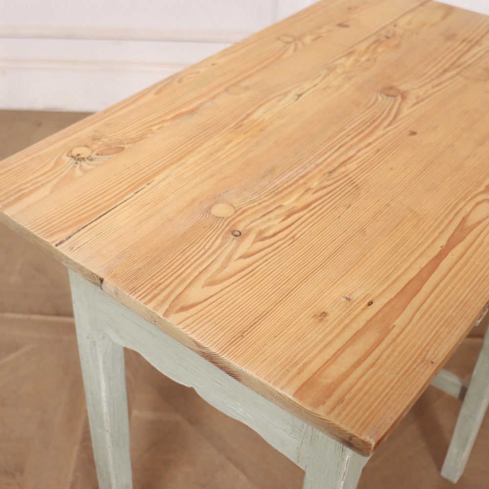A pair of 19th-century English side tables featuring natural pine tops, single frieze drawers, and pale green painted bases with square tapered legs. View VIII