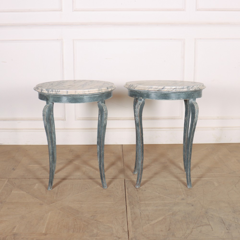 A pair of slim French painted wooden lamp tables featuring cabriole legs and oval marble tops. View II