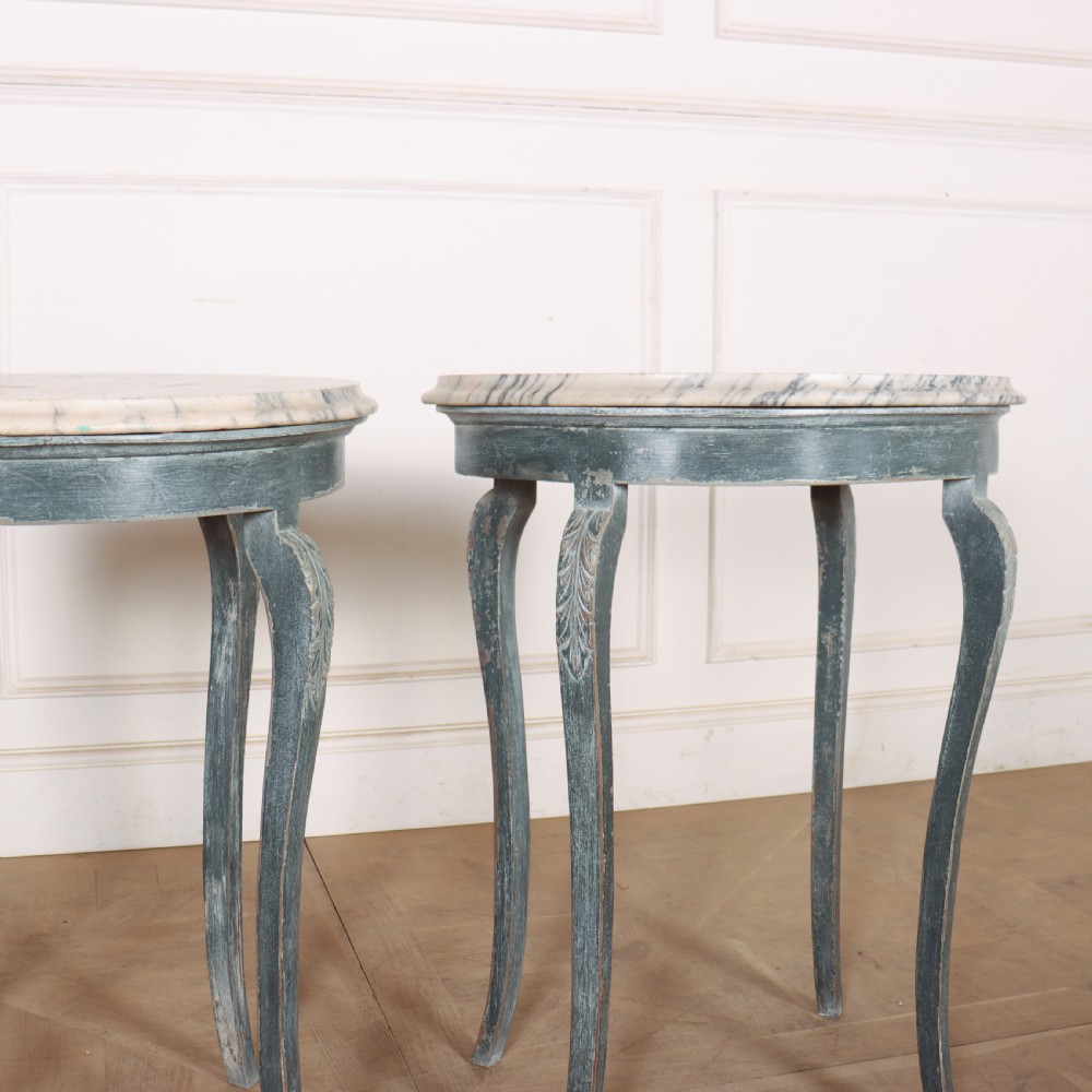 A pair of slim French painted wooden lamp tables featuring cabriole legs and oval marble tops. View III