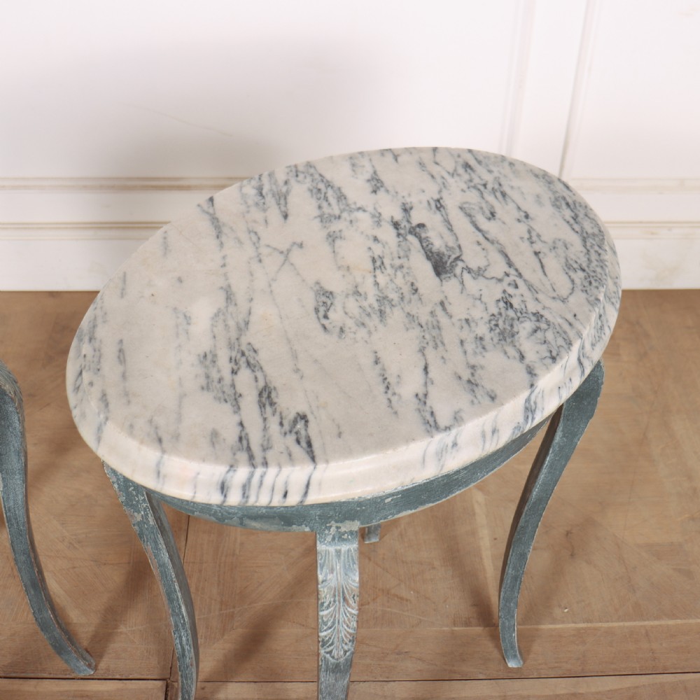 A pair of slim French painted wooden lamp tables featuring cabriole legs and oval marble tops. View IX