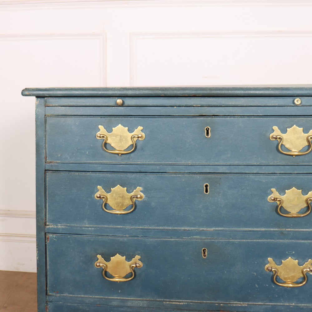 A four-drawer Georgian blue painted chest of drawers featuring brass swan-neck handles and bracket feet. View II