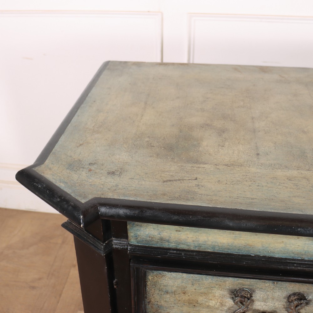 An 18th-century Italian three-drawer commode with a black painted frame, pale blue drawer panels, ornate brass handles, and bun feet. View XI