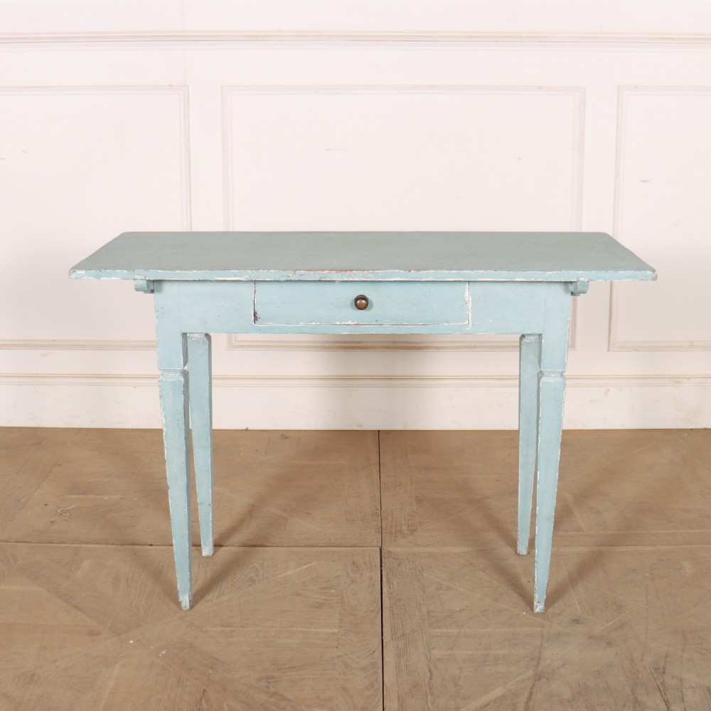 A rectangular light blue painted wooden lamp table featuring square tapered legs and a single drawer with a round brass knob.