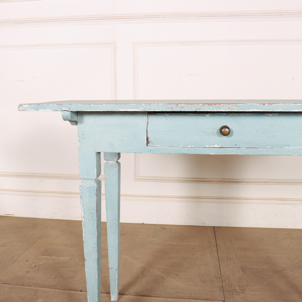A rectangular light blue painted wooden lamp table featuring square tapered legs and a single drawer with a round brass knob. View II