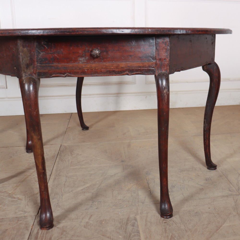 A pair of dark wood demi-lune console tables featuring semi-circular tops, single frieze drawers, and slender cabriole legs. View V