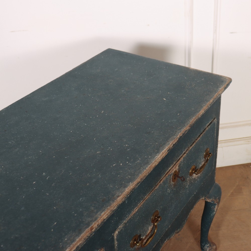 An antique blue-painted dresser base featuring three drawers with brass drop handles, a scalloped apron, and cabriole legs. View XIII