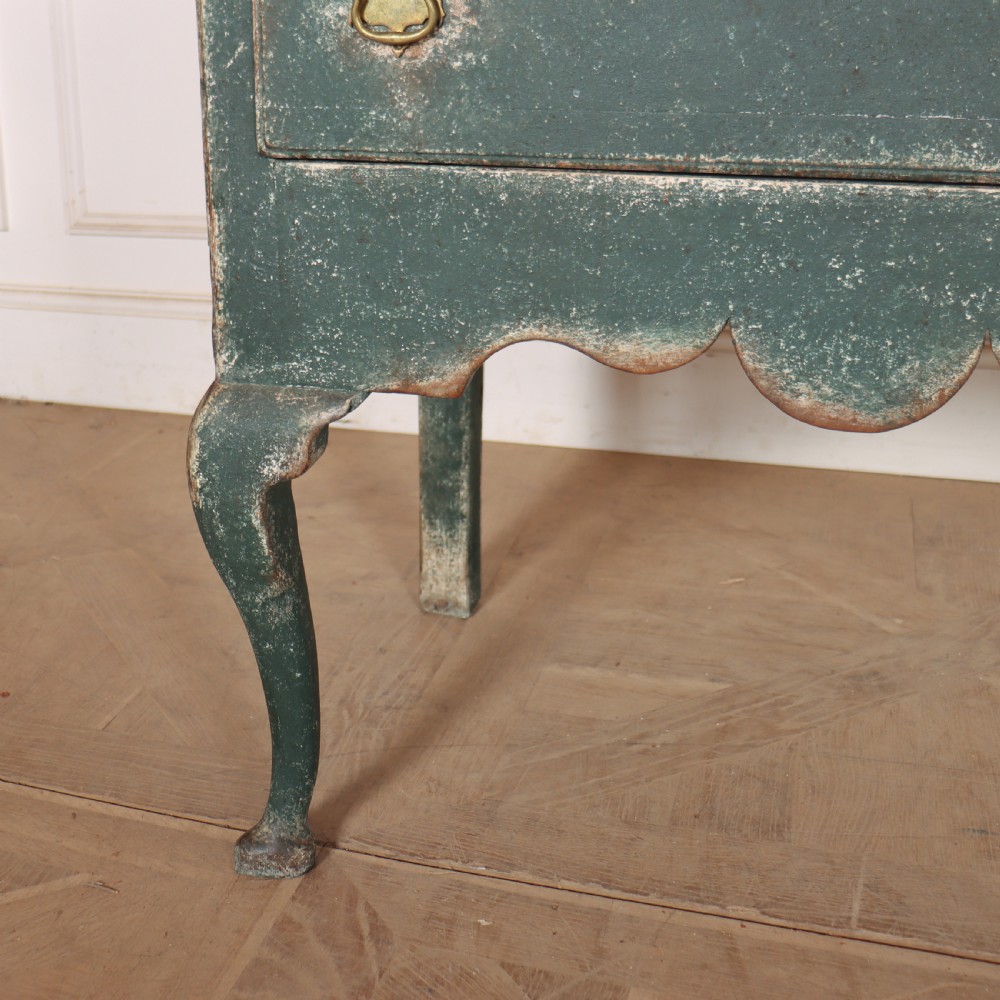 A long antique green painted dresser base featuring three drawers with brass handles, a scalloped apron with pierced fretwork, and cabriole legs. View VIII