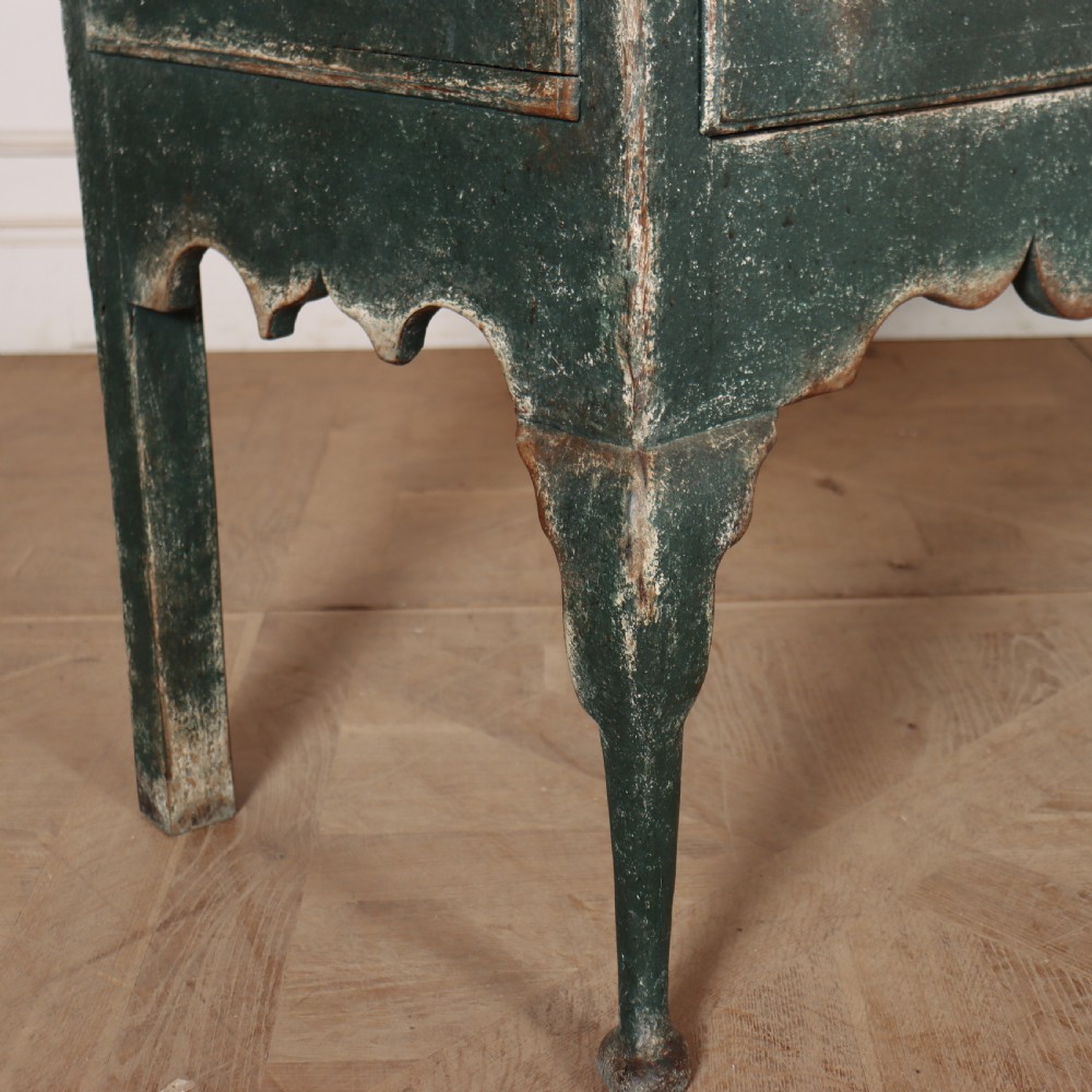 A long antique green painted dresser base featuring three drawers with brass handles, a scalloped apron with pierced fretwork, and cabriole legs. View XII