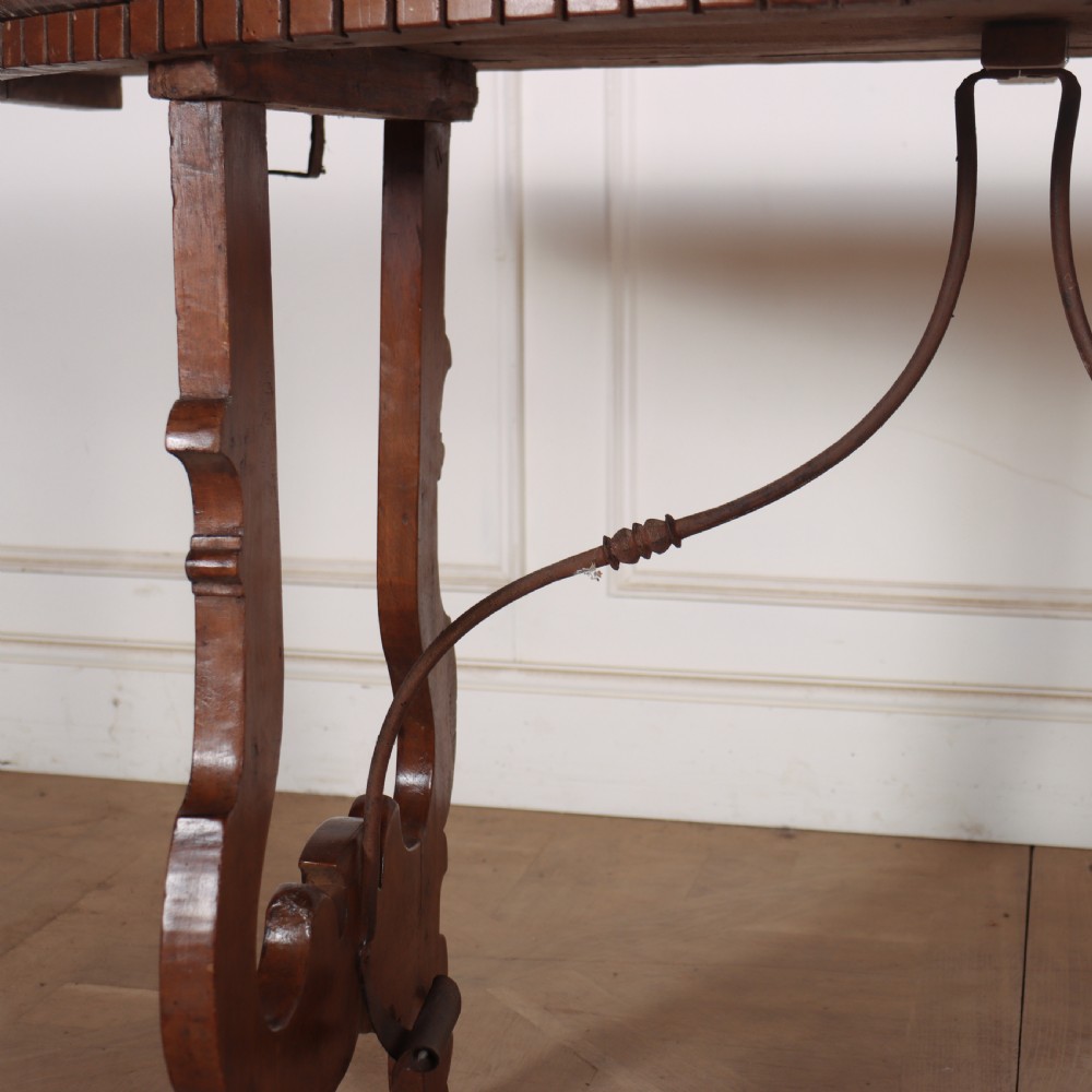 A pair of semi-circular Italian walnut console tables with carved apron detailing, lyre-shaped legs, and curved wrought iron stretchers. View VI