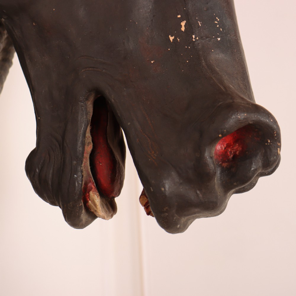A 19th-century dark painted plaster wall-mounted bust of a horse head in profile showing fine carved details. View VII