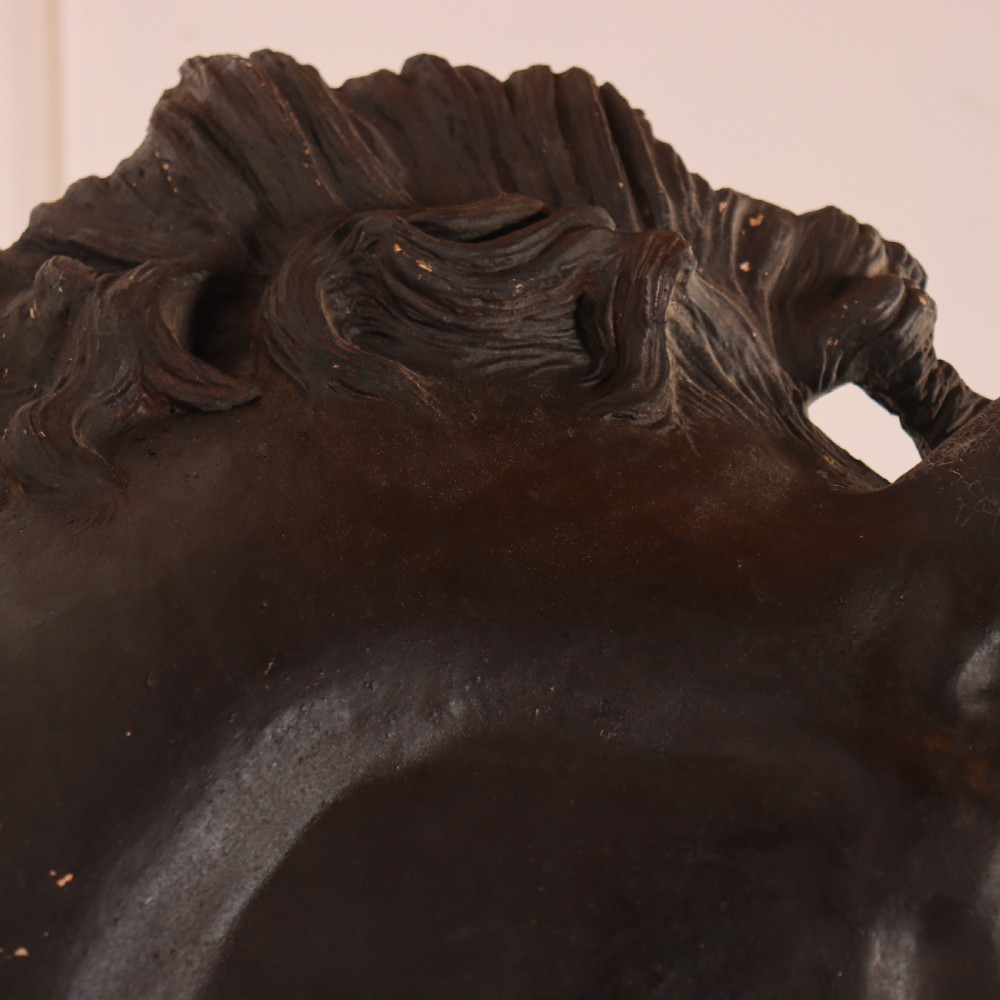 A 19th-century dark painted plaster wall-mounted bust of a horse head in profile showing fine carved details. View XI