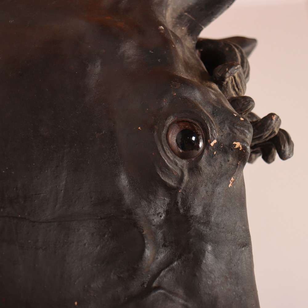 A 19th-century dark painted plaster wall-mounted bust of a horse head in profile showing fine carved details. View XIII
