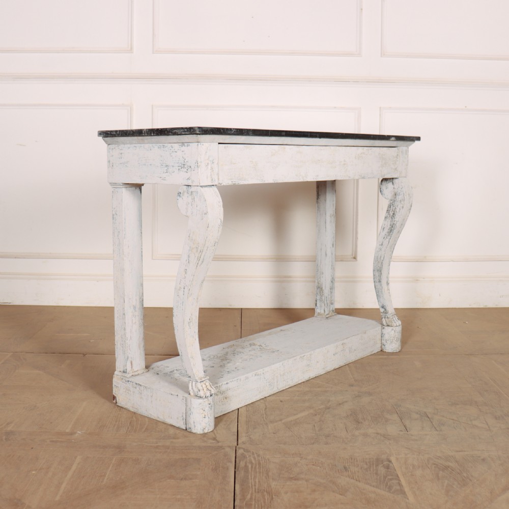 A French provincial painted wooden console table featuring a dark marble top and a lower display tier. View VII
