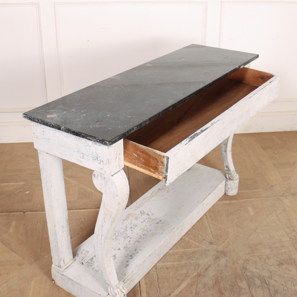 A French provincial painted wooden console table featuring a dark marble top and a lower display tier. View X
