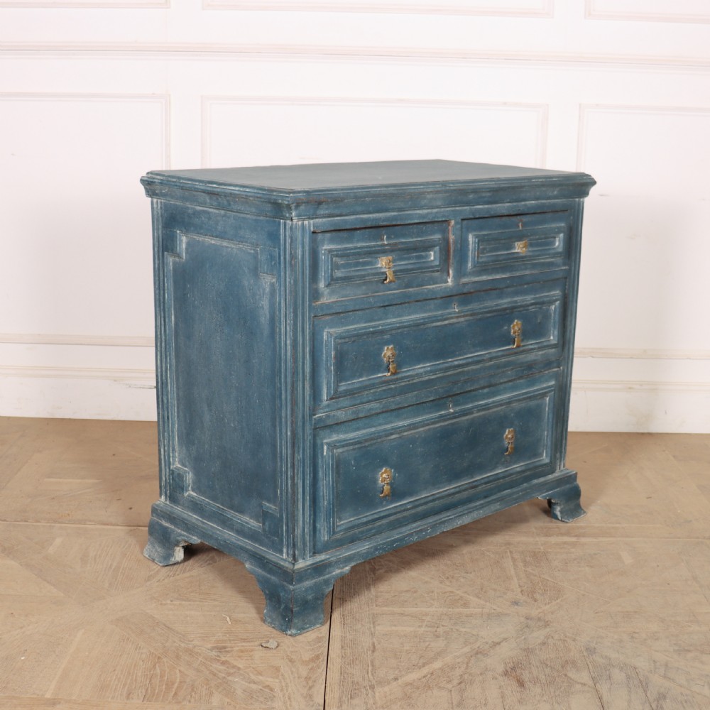 A Danish painted blue wooden commode featuring three drawers with brass handles and moulded panel details.