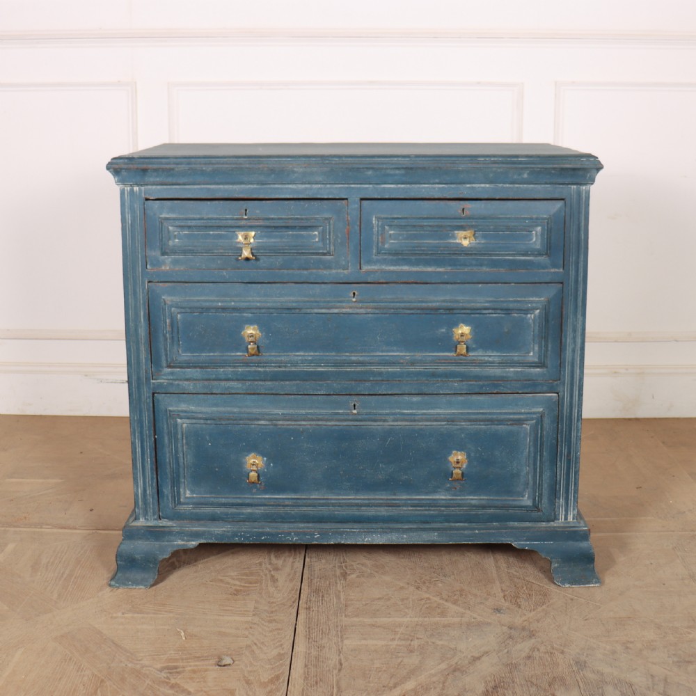 A Danish painted blue wooden commode featuring three drawers with brass handles and moulded panel details. View II