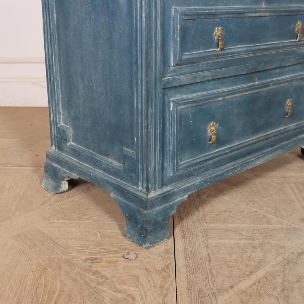 A Danish painted blue wooden commode featuring three drawers with brass handles and moulded panel details. View IV