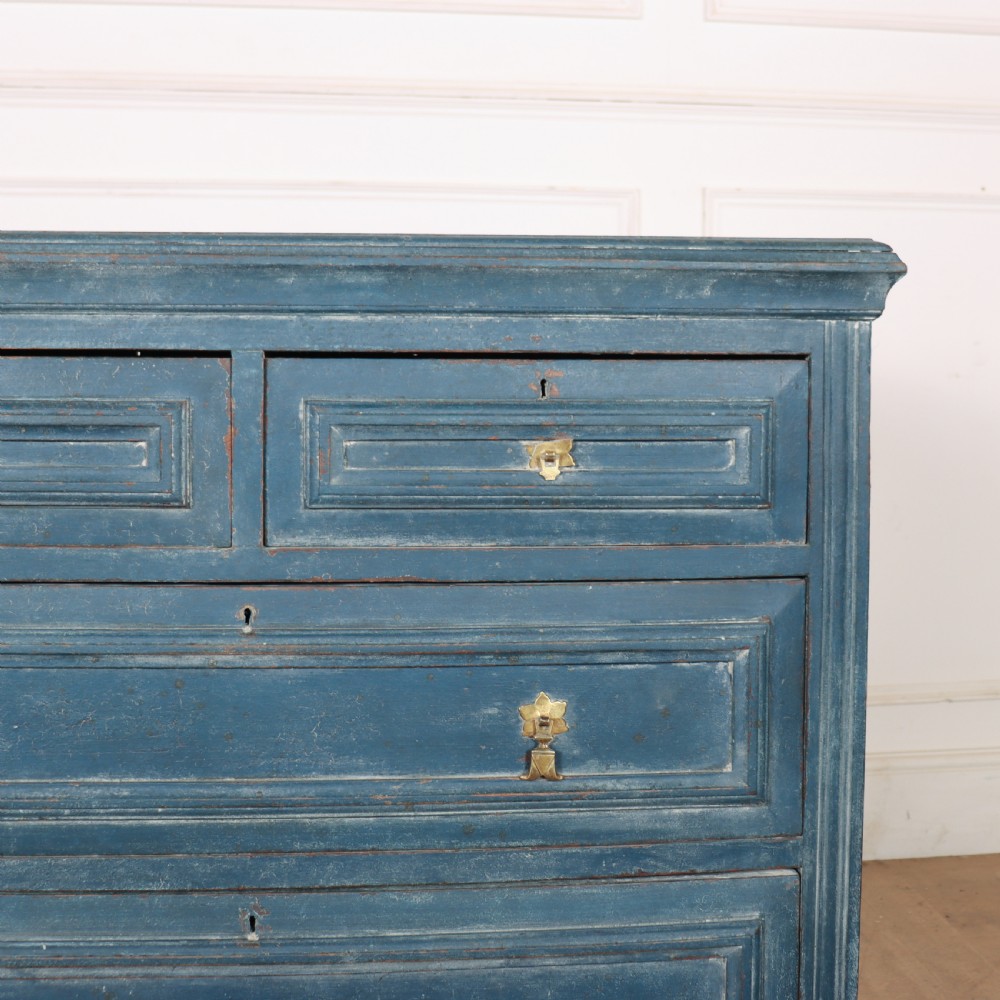 A Danish painted blue wooden commode featuring three drawers with brass handles and moulded panel details. View V