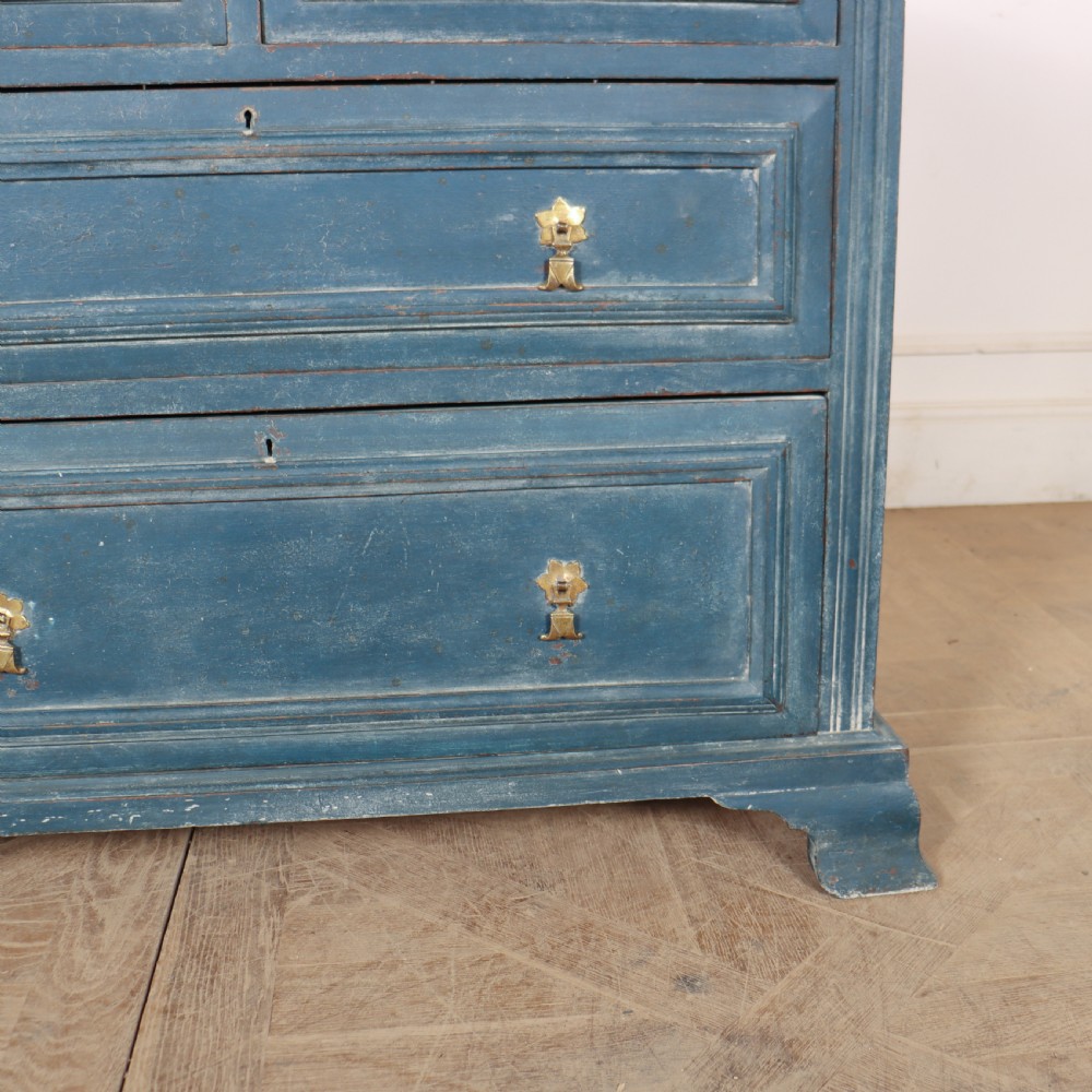 A Danish painted blue wooden commode featuring three drawers with brass handles and moulded panel details. View VII