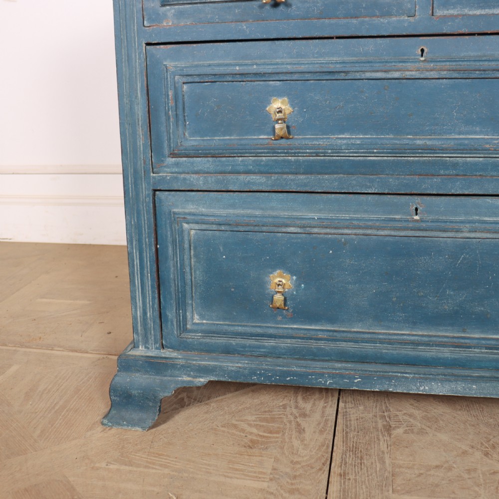 A Danish painted blue wooden commode featuring three drawers with brass handles and moulded panel details. View IX