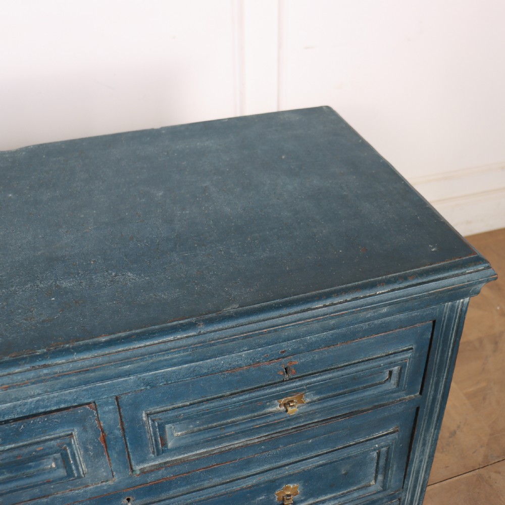 A Danish painted blue wooden commode featuring three drawers with brass handles and moulded panel details. View X