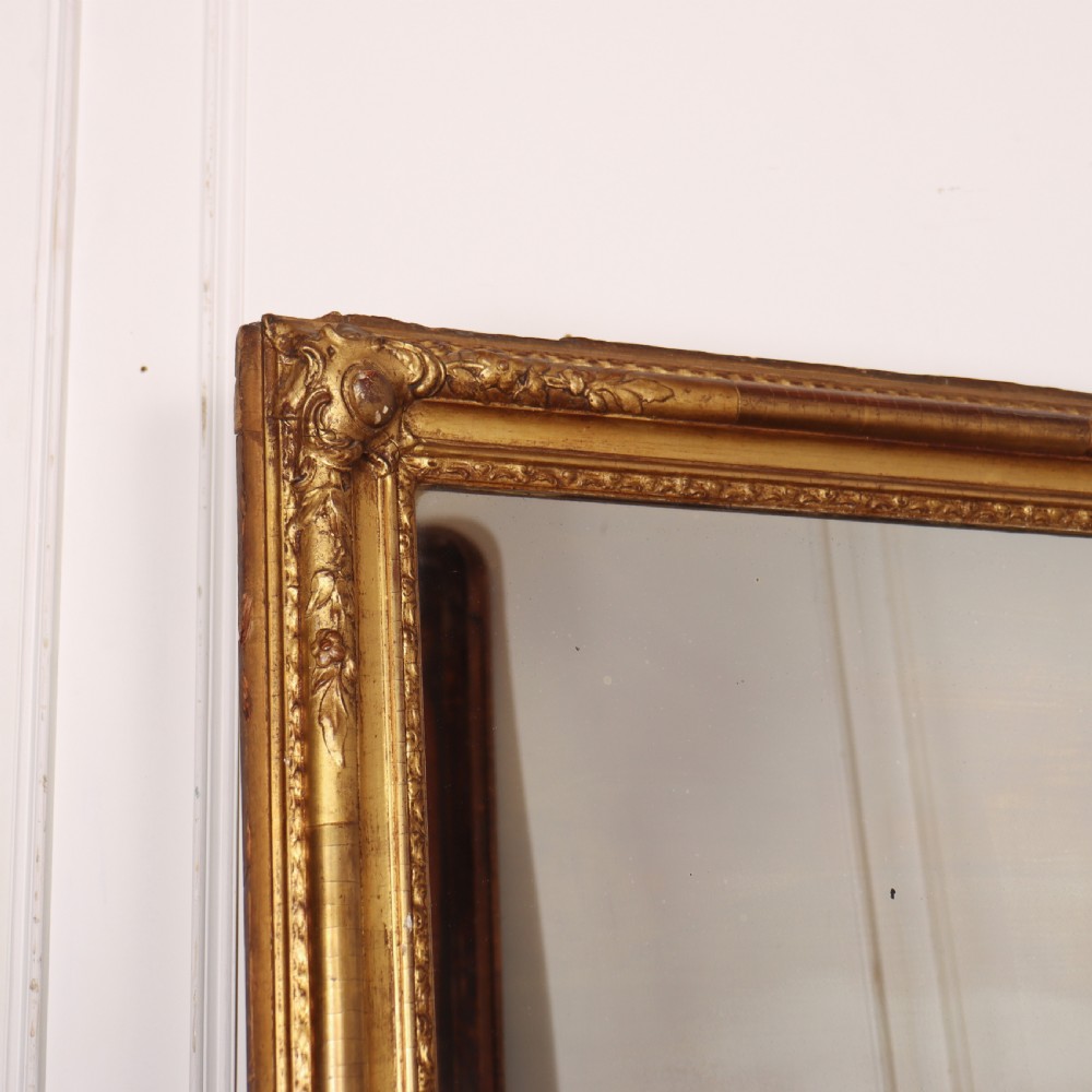 A large rectangular French antique mirror featuring a gold gilded frame with beaded moulding and carved corner details. View II