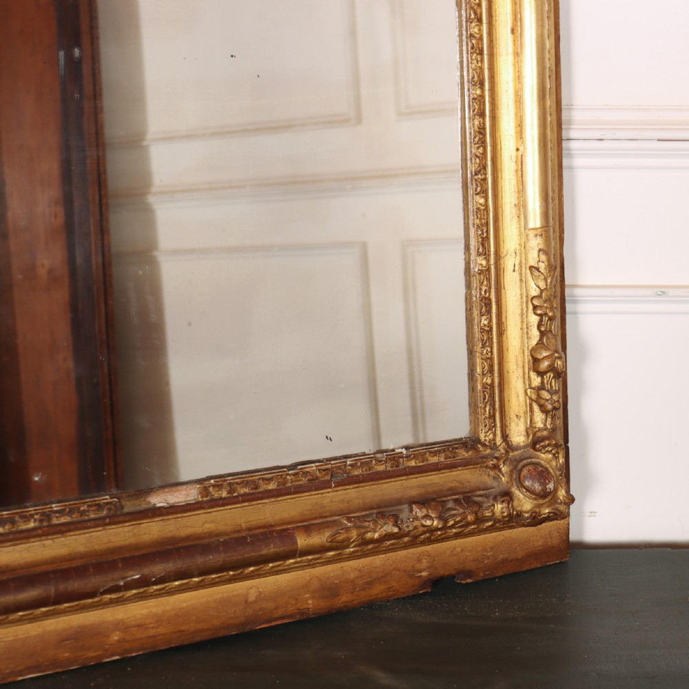 A large rectangular French antique mirror featuring a gold gilded frame with beaded moulding and carved corner details. View IV