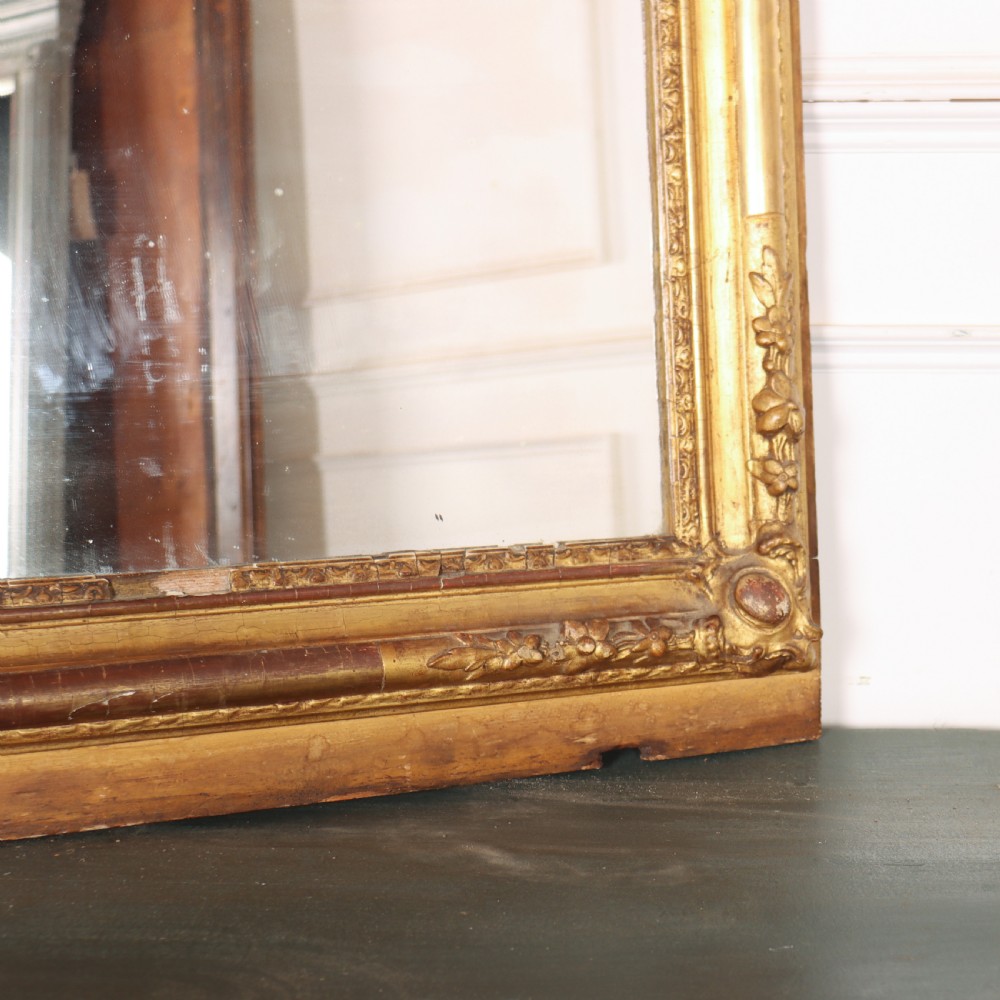 A large rectangular French antique mirror featuring a gold gilded frame with beaded moulding and carved corner details. View VIII