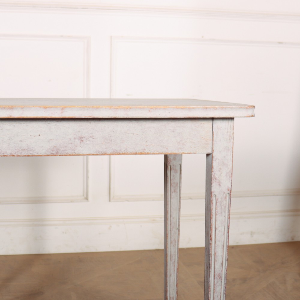 A pair of tall rectangular Swedish side tables with distressed pale grey painted finishes and slender tapered legs. View II