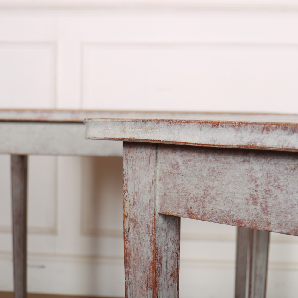 A pair of tall rectangular Swedish side tables with distressed pale grey painted finishes and slender tapered legs. View VII