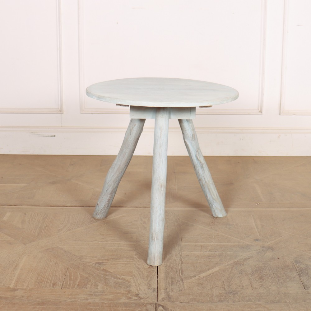 A circular three-legged English cricket table with a pale blue-grey painted finish. View IV