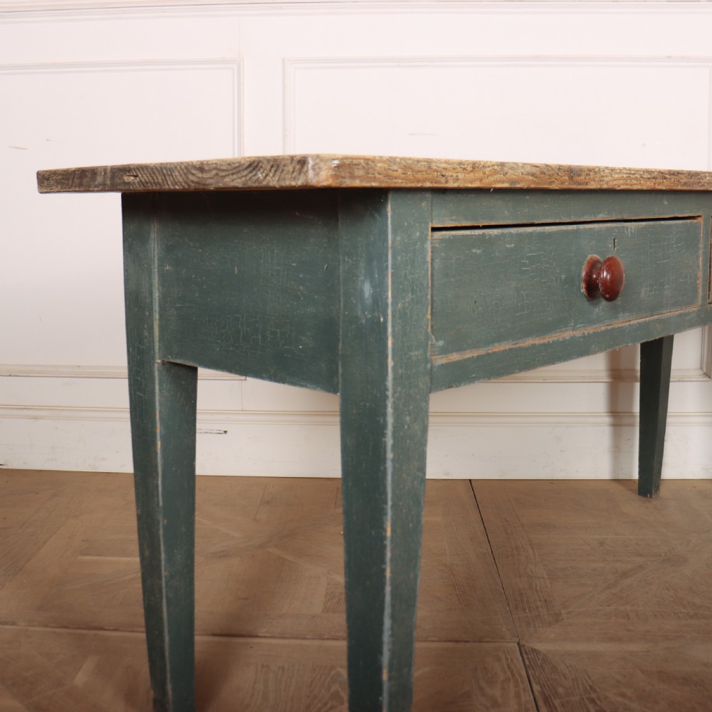 An antique Scottish console table featuring a muted green painted base with two drawers, dark wooden turned knobs, square tapered legs, and a natural pine top. View VIII