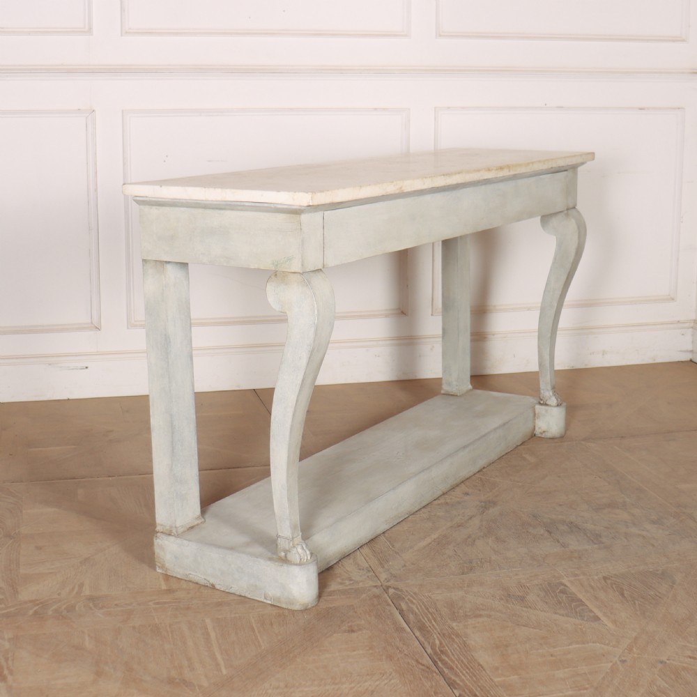 A pale grey painted French console table featuring a light marble top slab, cabriole front legs, and a bottom plinth shelf.