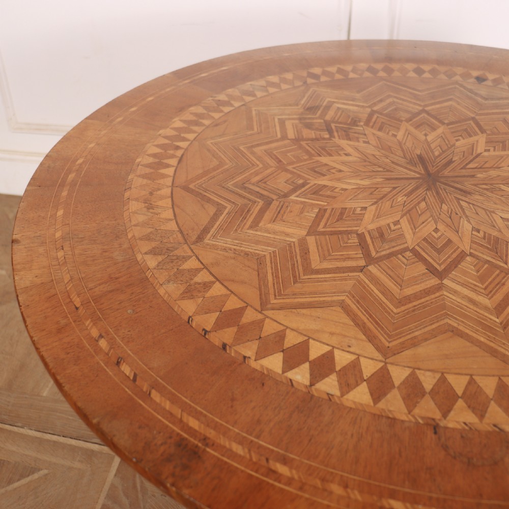 A circular 19th-century Swedish birch centre table featuring a turned central pedestal column resting on curved feet. View III