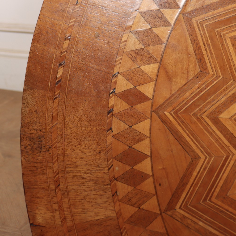 A circular 19th-century Swedish birch centre table featuring a turned central pedestal column resting on curved feet. View IV