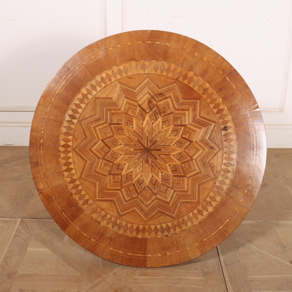 A circular 19th-century Swedish birch centre table featuring a turned central pedestal column resting on curved feet. View V