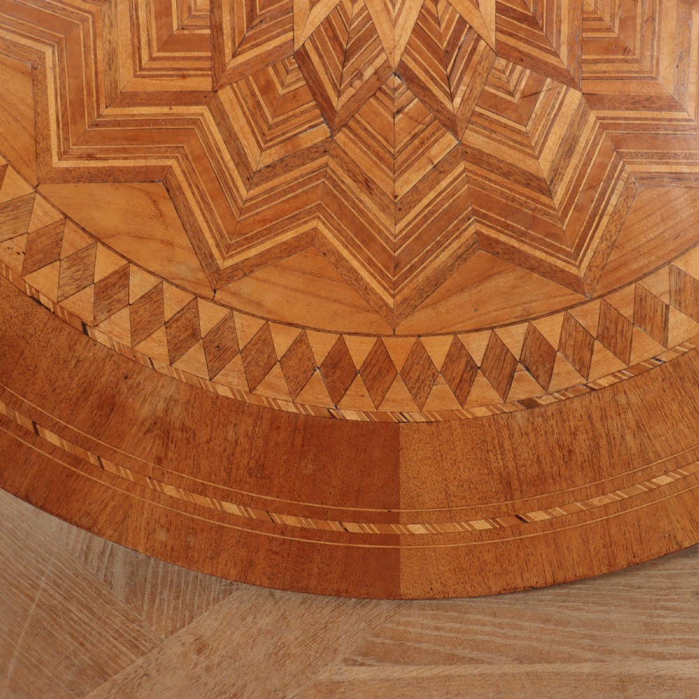 A circular 19th-century Swedish birch centre table featuring a turned central pedestal column resting on curved feet. View XI