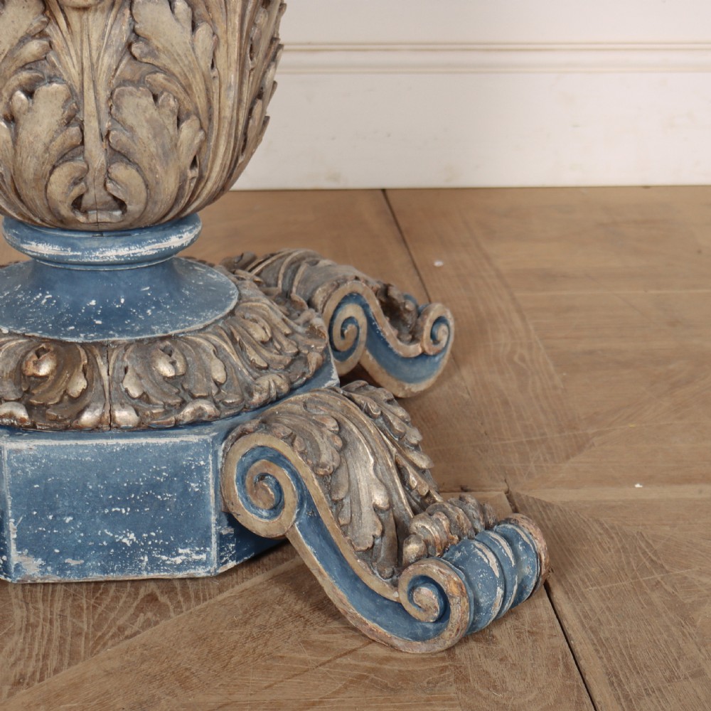 A circular 1920s German centre table featuring a distressed slate blue painted finish, gilt carved acanthus leaf pedestal, and scroll feet. View III