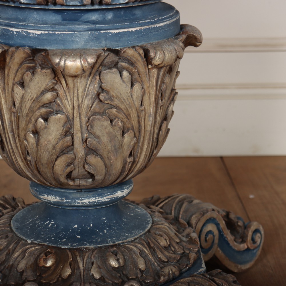 A circular 1920s German centre table featuring a distressed slate blue painted finish, gilt carved acanthus leaf pedestal, and scroll feet. View VII