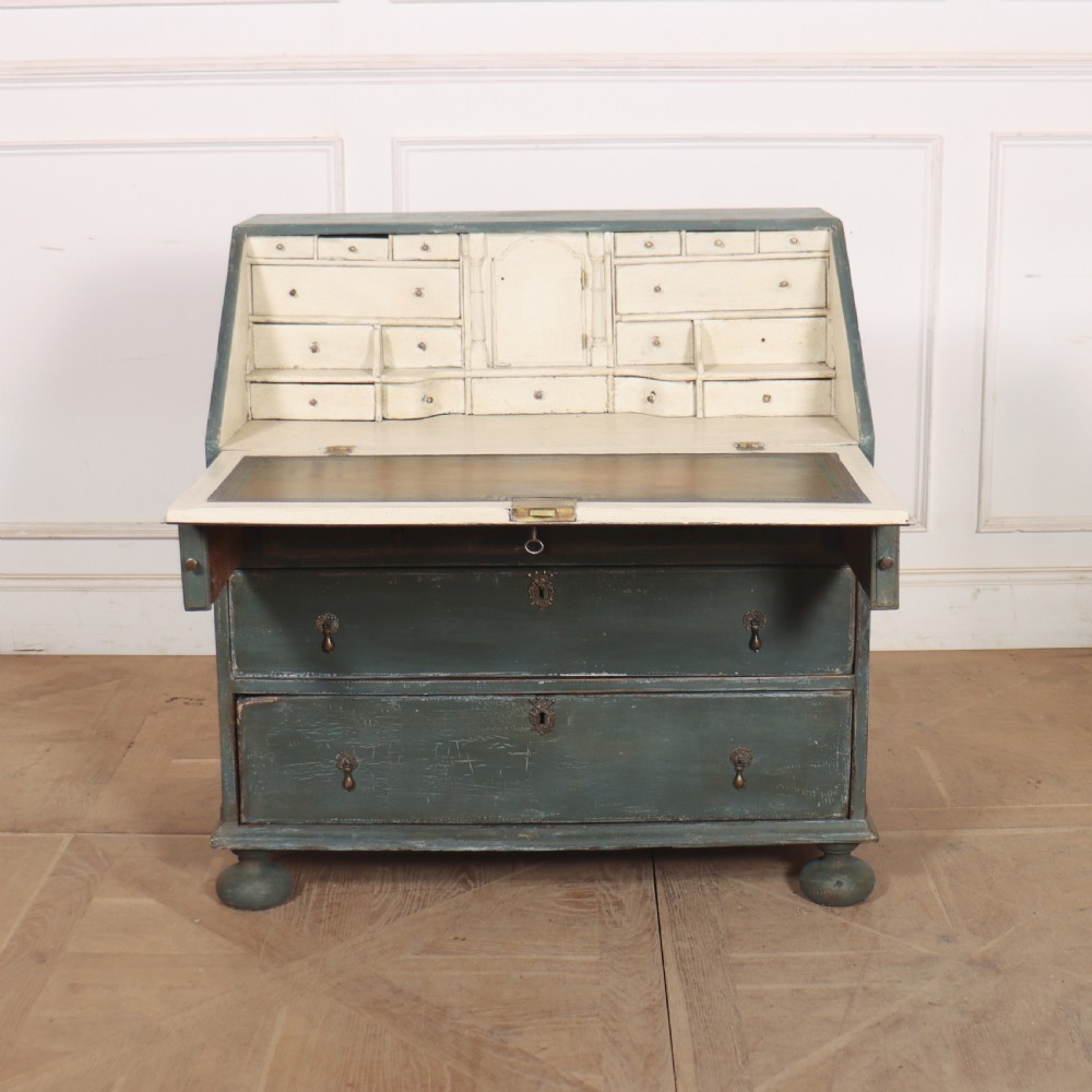 An 18th-century English slant-front bureau with a distressed grey-green painted finish, brass pull handles, and turned feet. View III