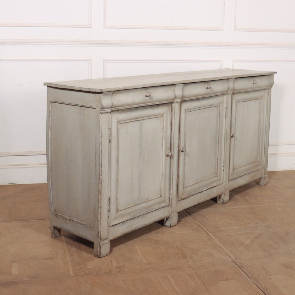 An antique French painted narrow enfilade in a distressed grey finish with three drawers over three panelled doors. View VIII