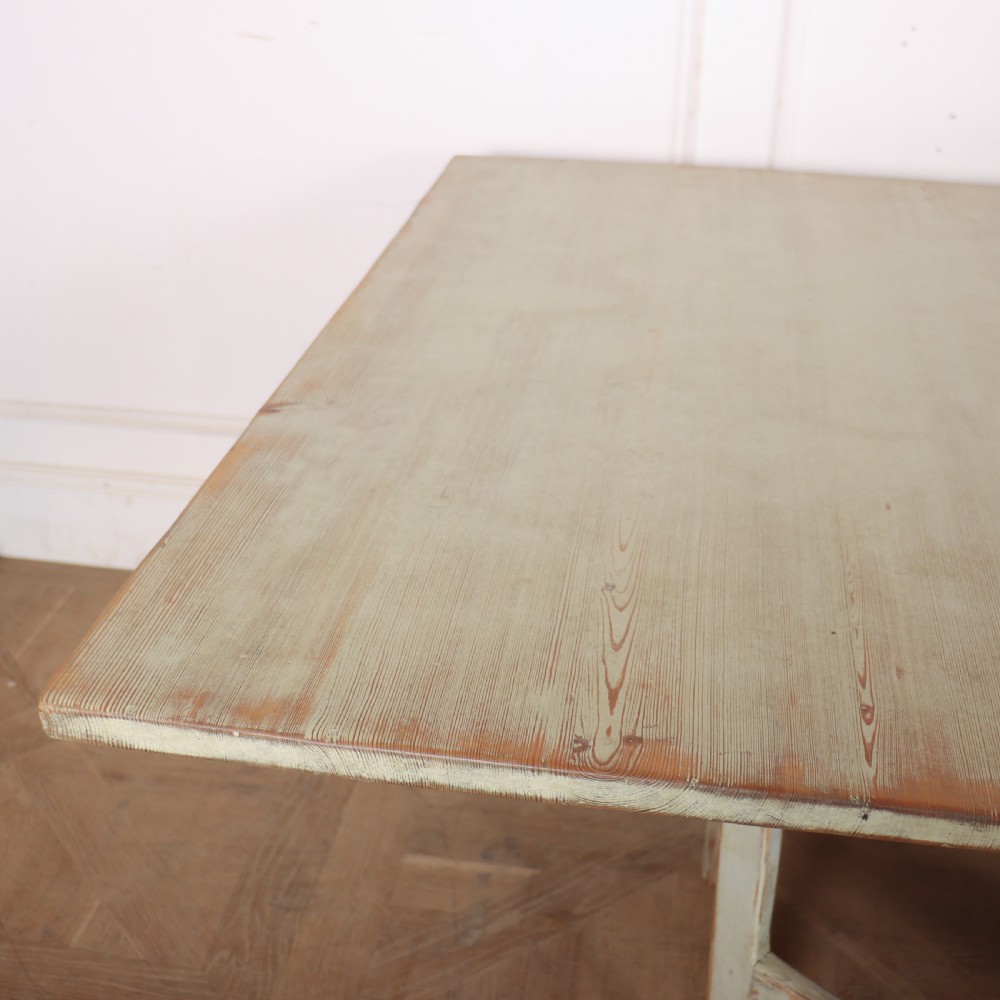 A folded Swedish slagbord drop-leaf dining table with distressed pale green paint over pine timber. View III