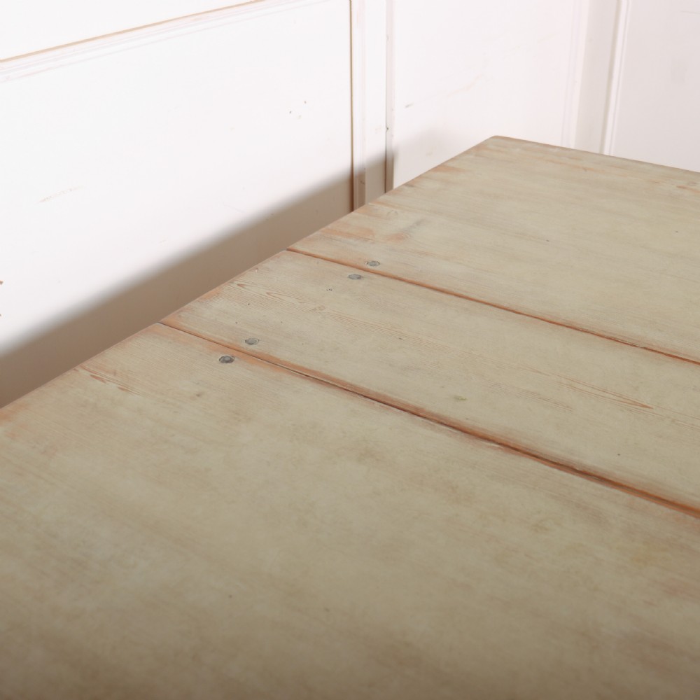 A folded Swedish slagbord drop-leaf dining table with distressed pale green paint over pine timber. View VII