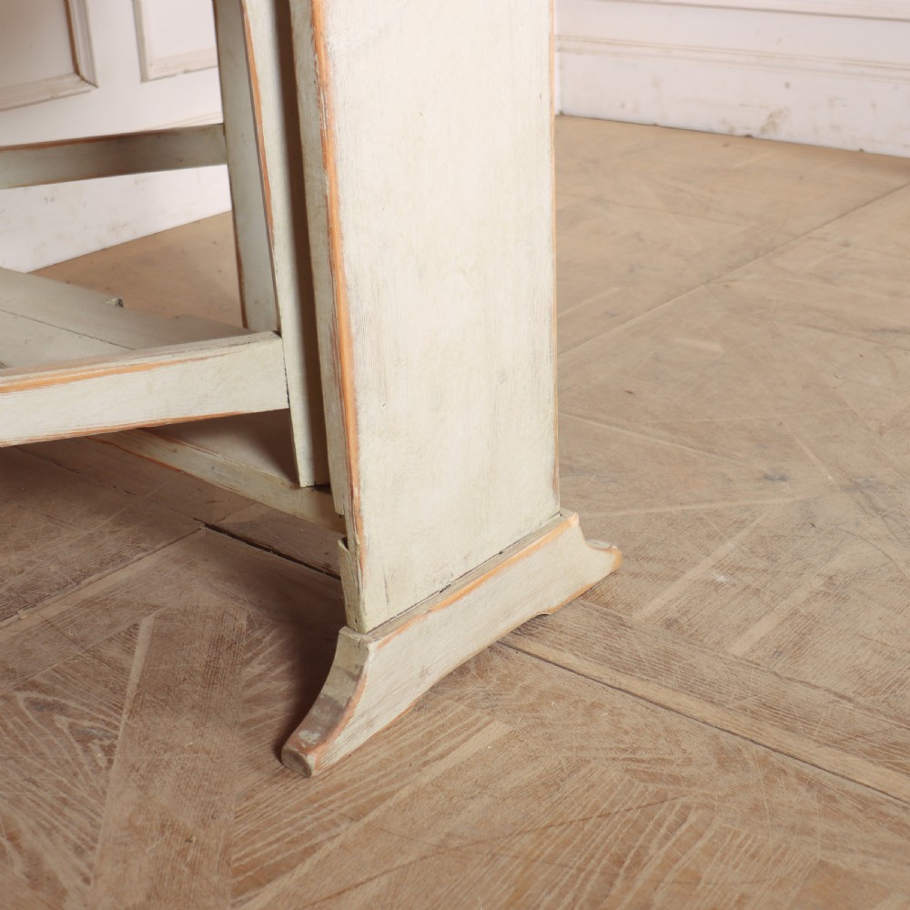 A folded Swedish slagbord drop-leaf dining table with distressed pale green paint over pine timber. View VIII