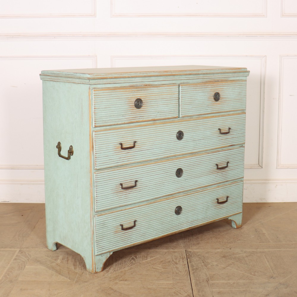 A Swedish painted pine commode featuring horizontal fluted drawer fronts, a pale blue distressed finish, and iron hardware. View VII