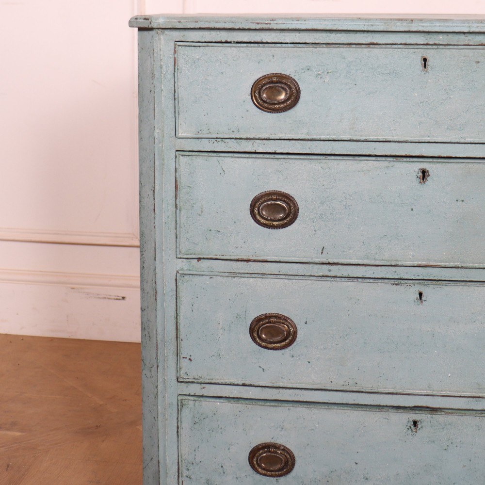 A pale blue painted Swedish commode with four drawers, oval brass pull handles, and square tapered feet. View II