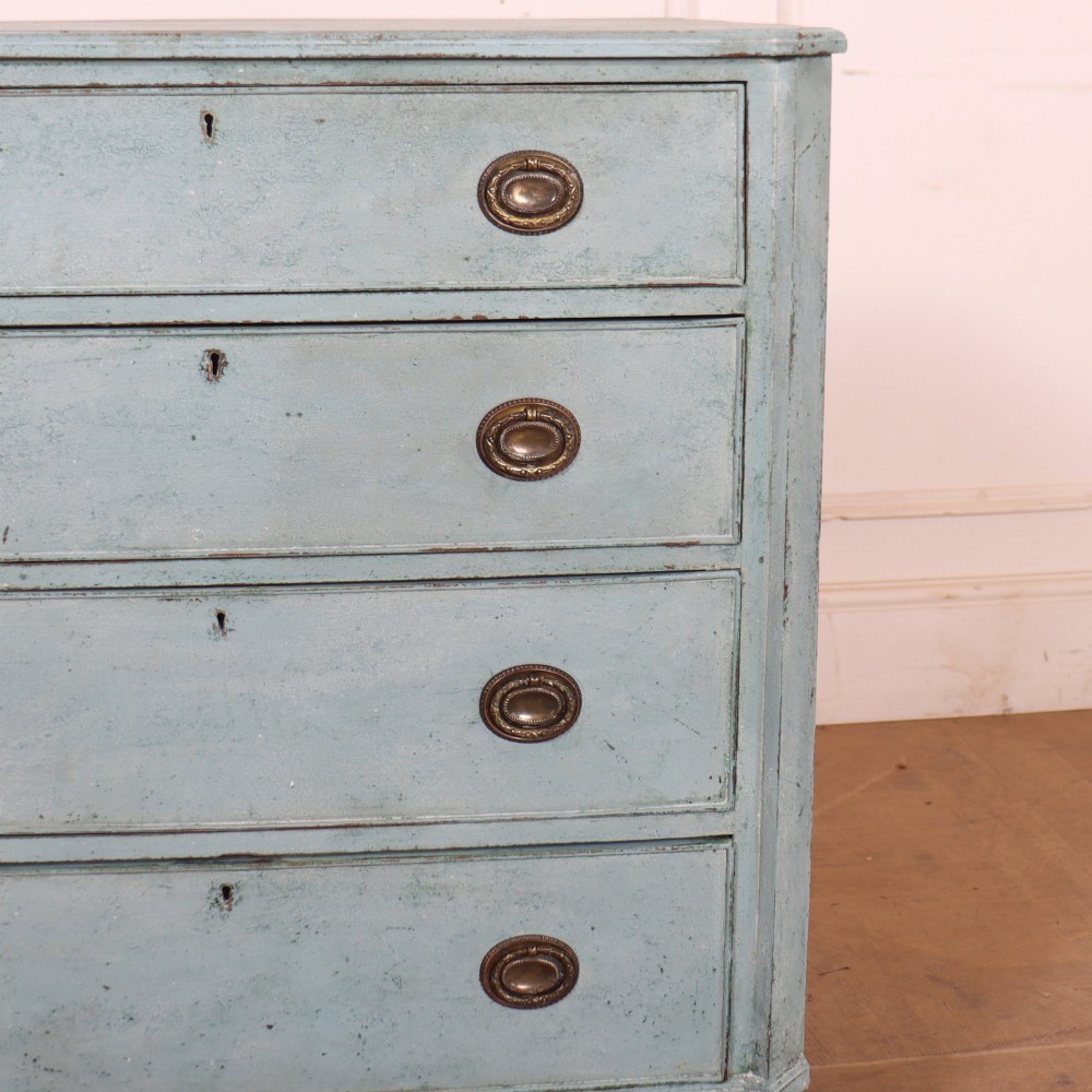 A pale blue painted Swedish commode with four drawers, oval brass pull handles, and square tapered feet. View III