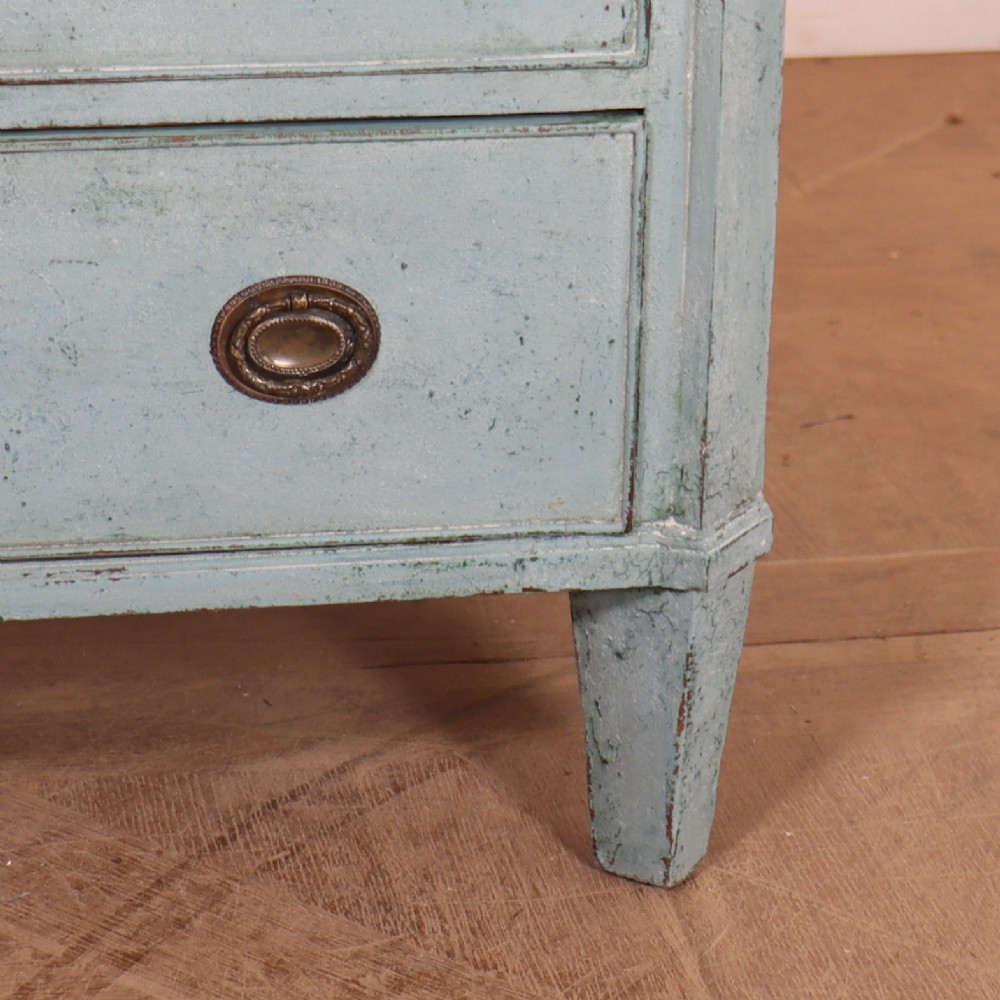 A pale blue painted Swedish commode with four drawers, oval brass pull handles, and square tapered feet. View IV