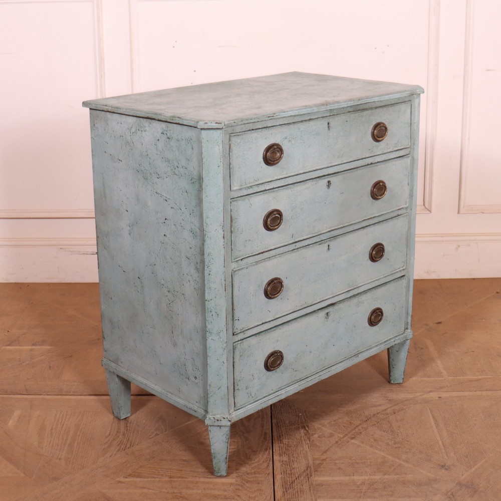A pale blue painted Swedish commode with four drawers, oval brass pull handles, and square tapered feet. View VII